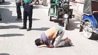 BCS student lying down on the road