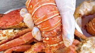 Top-ranking seafood boil _ indulge in juicy lobster tail dipped in spicy cajun sauce
