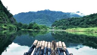 A wooden raft going slowly to a river