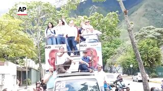 Thousands of opposition supporters gather with leaders in Venezuela for peaceful rally.
