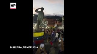 WATCH_ Protesters take down statues of Hugo Chavez in Venezuela.