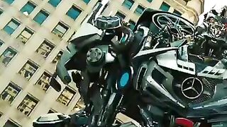 Soundwave's speaker is vibrating as Laserbeak speaks in Transformers