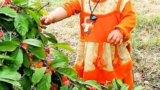 Lovely kid eating fruit