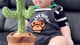 cute crying because of dancing cactus toy Funny cutie baby