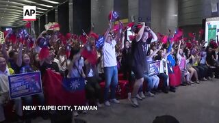 Fans celebrate as boxer Lin Yu-ting of Taiwan wins gold medal at Paris Olympics.