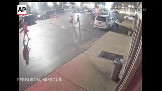 Ferguson police release footage showing protester knocking officer to sidewalk.