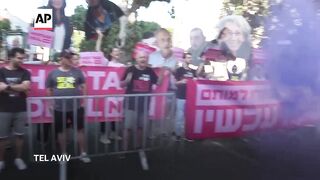 Families of hostages held in Gaza protest in front of the Independence Hall in Tel Aviv.