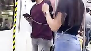 A cute girl with a handsome man in Metro.