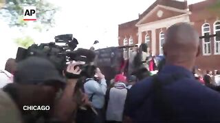 Protesters break through police fence near the DNC
