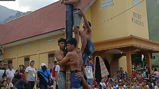 "Climbing for Glory: The Thrill of *Panjat Pinang*"