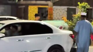 a boy shouting with a pedestrian