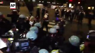 Protesters clash with police during final hours of the DNC