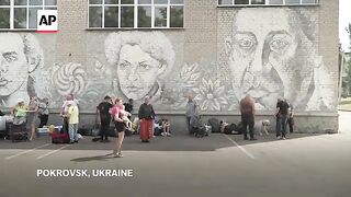 Ukrainians wait for buses and trains out of Pokrovsk as Russian forces advance towards city