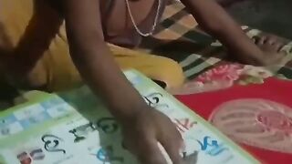 মা তার ছেলেকে পড়া শেখাচ্ছে