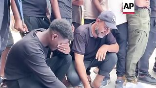 Mourners pray for three men killed by Israeli strike in central Gaza