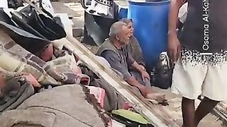 Palestinian families in Gaza take refuge in a cemetery