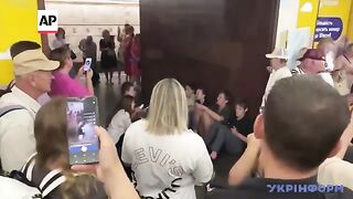Kyiv residents sing city's anthem in subway as air raid sirens go off