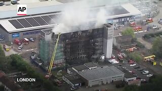 Fire engulfs apartment building in east London