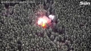 Ukrainian soldiers destroy three Russian tanks and ammo dump hidden in forest