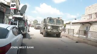 Israeli military vehicles seen moving in Jenin, West Bank and helicopters overhead