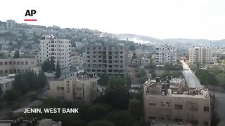 Smoke rises over Jenin as Israeli military raid into West Bank goes on