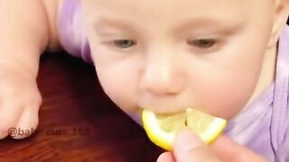 Sweet Baby eating orange