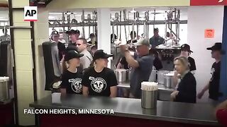 It's a pork chop on a stick and a vanilla shake for Tim Walz at the Minnesota State Fair