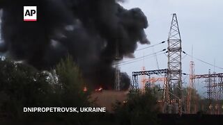Ukrainian firefighters extinguish flames at electrical substation hit by Russian bombing