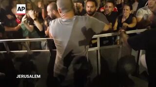 Scuffles in Tel Aviv as protesters increase pressure on Netanyahu to reach cease-fire deal.