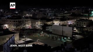 Palestinian protesters and Israeli soldiers clash in Jenin, West Bank.