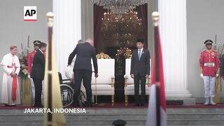 Pope Francis welcomed by Indonesian president in Jakarta.