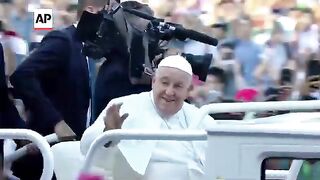 Pope Francis celebrates Mass before an estimated 100,000 people at Jakarta stadium