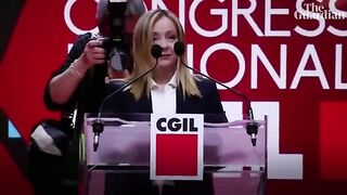 Giorgia Meloni greeted with anti-fascist song Bella Ciao at convention