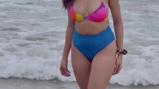 Awesome Girl in Red Bikini in the Sea