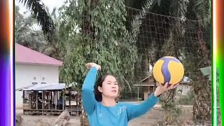 beautiful girl teaches us how to serve volleyball correctly