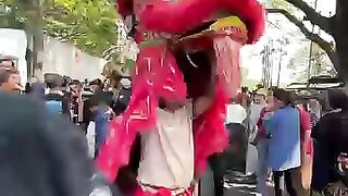 The lion dance has its head ripped off LOL