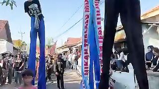 long legs take part in the village carnival