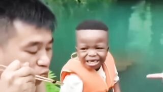 African Child's first meal with his new chinese family