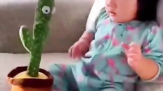 Babies reaction seeing cactus ???? toy first time ????????????????????