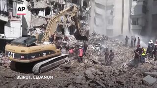 Beirut suburb wakes up to collapsed buildings after Israeli airstrike kills 31.