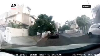 Car camera shows Hezbollah rocket hit in northern Israel.