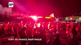 Thousands defy bans on protests in Martinique.