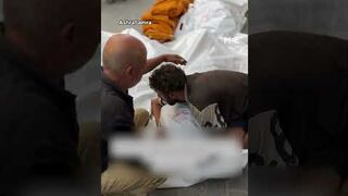 Palestinian man grieves for family killed in Israeli strike