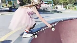 Six years old girl is a skateboarding