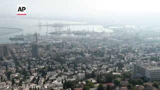 Sirens and smoke in Israel's Haifa following an alert of incoming rockets.