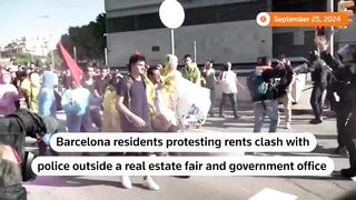 Barcelona police chase protesters outside real estate fair .