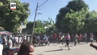 Gang raids a small town in Haiti and kills more than 20, including children.
