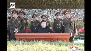 North Korea releases images of Kim Jong Un watching artillery firing exercise.