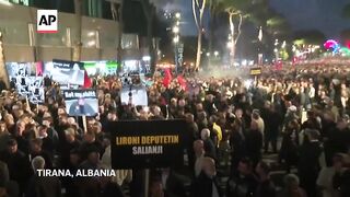 Albania's opposition supporters demand a caretaker Cabinet, clash with police at protest.