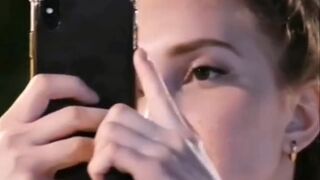 Russian Beauty Engrossed in Her Mobile